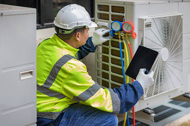 Professional Hvac technician working in Milton Village, MA